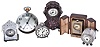 Clocks- 6 (Six): including a miniature carriage clock with outer case, a "Tip Top Traveler", two mother of pearl clad miniatures, one barrel form, a silver repousse miniature in the rococo style, and a Waltham paperweight clock