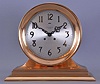 Chelsea Clock Co., Boston, Mass., retailed by Spaulding & Co., Chicago, "Commander" on metal base with 8 1/2" special dial, 8 day, spring driven, time and ship's bell striking movement in a polished brass case mantel clock