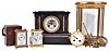 Clocks- 4 (Four) French mantel: (1) carriage clock, time and alarm with leather covered case; (2) carriage clock, time and strike; (3) black marble with visible escapement; (4) bow front time and strike crystal regulator with mercury pendulum