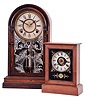 Clocks- 2 (Two): (1) Ansonia Clock Co., New York, NY, 8 day, time and strike spring driven movement shelf clock, c1883; (2) American, 30 hour, time and alarm spring driven movement miniature cottage timepiece, c1865