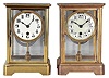 Clocks- 2 (Two) Boston Clock Co., Boston, Mass. Crystal Regulators: (1) 8 day spring driven movement with single arbor winding time and strike brass lever movement, c1900; (2) 8 day spring driven movement with single arbor winding time and strike brass lever movement, c1900.