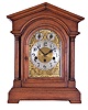 Junghans, Germany, 8 day spring driven movement, three train Westminster chime bracket clock with A13 movement in an architectural style mahogany case. The clock chimes the quarters on 4 rods. The hour is struck on a fifth deeper toned rod, c1900.