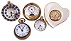 Clocks- 5 (Five): Four paperweight clocks, one an 8 day "Hebdomas", another 8 day Swiss with brilliant set bezel, a 30 hour Swiss with Arabic numeral enamel dial, a New Haven, and a heart shaped "Lenox" with quartz movement