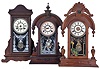 Clocks- 3 (Three): (1) Ansonia Clock Co., New York, unidentified shelf clock with a spring driven, 8 day time and half hour strike movement in an oak case, c1910. ; (2) William L. Gilbert Clock Co., Winsted, Conn., "Parisian - Walnut" shelf clock with a spring driven, 8 day, time and strike movement with a simple calendar mechanism in a walnut case, c1885; (3) New Haven Clock Co., New Haven, Conn., "No. 503" shelf clock with a spring driven, 8 day time, strike and alarm movement in a black walnut case, c1886.