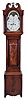 England, unsigned tall clock, 8 day, time and bell strike, weight driven movement, mahogany case with broken arch hood with brass rosettes, convex crotch mahogany panel 3/4 columns on trunk and fan carved crotch mahogany panel on lower plinth with painted metal dial with moon phase, swan spandrels.