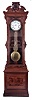 New Haven Clock Co., New Haven, Conn., "Regulator No. 4", jeweler's regulator floor standing clock, 8 day, time only, weight driven movement with Swiss pinwheel escapement and gridiron lyre pendulum in a walnut case with burled walnut highlights with jeweler's private label "PISTELL AND SCHNEIDER JEWELERS-OPTICIANS" stenciled on front of trunk door and Jenny Lind crest with a white enamel dial and center sweep seconds