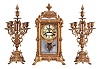 Ansonia Clock Co., New York, NY, "Excelsior" Crystal Regulator with two matching candelabra (No. 1110) with a spring driven, 8 day time and half hour strike movement (rack & snail strike) in a gilt finished brass case.