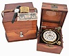 First Moscow Watch Factory, USSR, two day marine chronometer, 15 jewel, damascened, gilt movement with fusee, break circuit mechanism, and integral balance with helical hairspring, Arabic numeral silvered dial with gilt spade and poker hands, mounted in a gimbaled bowl and contained in a brass mounted mahogany box, and with outer, lined protective mahogany box, serial #11577, together with a Soviet era boxed wristwatch, and more, 20th century