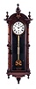 Welch, Spring & Co., Forestville, Conn., "Regulator No. 7" or often called the wall "Patti", walnut case with a profusion of turned ornament and flocked paper interior, Roman numeral painted dial, blued steel hands, 8 day, weight driven brass timepiece with sweep seconds, pendulum with gilt rod