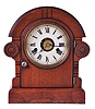 Seth Thomas Clock Co., Thomaston, Conn. with a spring driven 30 hour time, strike and alarm movement shelf clock in a mahogany veneered case.