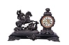 Ansonia Clock Co., New York, NY, "Boar Hunter" figural mantel clock with a spring driven, 8 day, time and strike movement with visible escapement in a enameled iron base with a bronzed spelter statue.