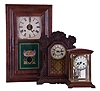 Clocks- 3 (Three) American Mantel: (1) Waterbury Clock Co., Waterbury Conn., crystal regulator, 8 day time and strike, spring driven movement with simulated mercury pendulum in case with wooden top and bottom; (2) Waterbury Clock Co., Waterbury Conn., "Unity", 8 day time and gong strike, spring driven movement shelf clock in a walnut case; (3) William S. Johnson, NY, OOG mantel clock, unsigned 30 hour time and strike weight-driven movement in a mahogany veneered case.