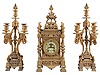 Ansonia Clock Co., New York, NY, "The Regent" mantel clock with matching candelabra, fancy cast case with gilt finish, Arabic numeral white enamel dial, 8 day, time and strike movement