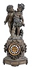 Ansonia Clock Co., New York, NY, "Florida"  base with 1089 group (Cherubs) figural shelf clock with a spring driven, 8 day, time and rack & snail strike movement with visible escapement in a cast metal case with a Barbedienne finish.