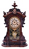 Ansonia Clock Co., New York, NY, "Monarch" mantel clock with 8 day, spring driven time and strike movement, in a walnut case with applied metal ornaments, patented pendulum, and dedication plaque dated 1892.