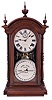 Southern Calendar Clock Co., St. Louis, Mo., "Fashion No. 4" double dial shelf clock with a Seth Thomas spring driven, 8 day, time and strike movement with an R. T. Andrews patented perpetual calendar mechanism in a walnut case.