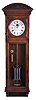 Waltham Clock Co., Waltham, Mass., "Regulator No. 14", jeweler's regulator wall clock, oak and quarter sawn oak case with fan carvings and carved arch top, Roman numeral silvered dial with blued steel hands, 8 day, ornately damascened weight driven timepiece movement with Graham dead beat escapement, and nickel plated three vial mercury pendulum with metal jars