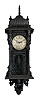 Wall clock, the case of tropical hardwoods, replete with Asian and Moorish inspired carving, the base with a winged figure, the door with leafy columns and with figures at the top corners, flat surfaces with geometric and naturalistic repeating motifs, the top with a ribbed dome, and turned finial, Arabic numeral silvered dial, blued steel trefoil hands, English 8 day, time and strike fusee movement, and pendulum with patinated Helios mask pendulum
