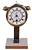 Boutteville a Paris, a year going clock movement with equipoise pendulum, Roman numeral white enamel dial with sunk center, the recessed panel with seconds bit and wind indicator, blued steel Breguet style hands, brass movement with round plates and Leroux deadbeat escapement, with purpose made base