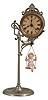 Ansonia Clock Co., New York, NY, "Jumper No. 1" bobbing doll shelf clock with a spring driven one day timepiece movement in a nickel plated case.