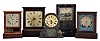 Clocks- 5 (Five): The first probably Chauncey Goodrich, ebonized, rectilinear case with mother of pearl, gilt and polychrome ornament, Roman numeral painted dial, 8 day, time and strike movement, the next probably by Jerome, rosewood veneered case with gold moldings, Roman numeral painted dial, 8 day, time and strike movement, the third a Waterbury cottage, softwood case with mahogany veneered front, Roman numeral painted dial, 30 hour timepiece movement, the next a Jerome cottage case and dial, door glass with decorative painted dial surround, and an unidentified 30 hour timepiece with applied composition ornament, dimensions of Goodrich listed