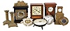 Clocks- 8 (Eight) Mantel & Desk: (1) Austria, bracket clock, 8 day, time and strike in a wood case with brass basket top and silvered chapter ring; (2) Winterhalder & Hofmeier, Germany, mantel clock, 30 hour, time and strike in a walnut case; (3) "Rapid Ralph" novelty clock; (4) Benzie Cowes, England, wall clock in nickel case; (5) Hanging clock, 30 hour, time only in ornate ceramic case; (6) Germany, car clock with a brass mounting plate; (7) Hamburg American Clock Co., Germany, 8 day, time only in wood case; (8) Watch-sized movement in miniature chest of drawers; (9) and (10) brass candlesticks.