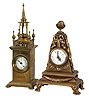 Clocks- 2 (Two) German and Swiss Mantel: (1) Hamburg American Clock Co., Germany, 30 hour time only lever movement in a brass architectural case with jeweled spire and cream colored porcelain dial. (2) Swiss, 30 hour, 17 jewel time only movement in a brass case with claw feet, bowknot suspended trophy ornaments topped with a globe, holding a white polychrome dial with Arabic numerals.