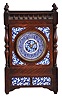 French, oak cased mantel clock with blue and white inserts and dial, 8 day, time and strike, with a movement stamped "C. J. & Co.", the case with turned corner columns and finials.