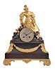 France, a gilt and multicolor patinated bronze figural mantel clock, the red patinated base with incurved sides resting on gilt scroll feet, with gilt acanthus corners suspending a floral festoon, supporting a rocky pinnacle, on which a stylish young woman and her dog rest, Roman numeral, engine turned silvered dial with gilt bezel, blued steel Breguet style hands, 8 day, time and strike, pendule de Paris movement with silk thread suspension