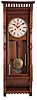 Ansonia Clock Co., New York, NY, "Santa Fe" wall hanging clock with a double weight driven timepiece movement in a walnut case.