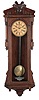 Ansonia Clock Co., New York, NY, "Bagdad" wall hanging clock with a spring driven, 8 day double wind timepiece movement in an oak case.