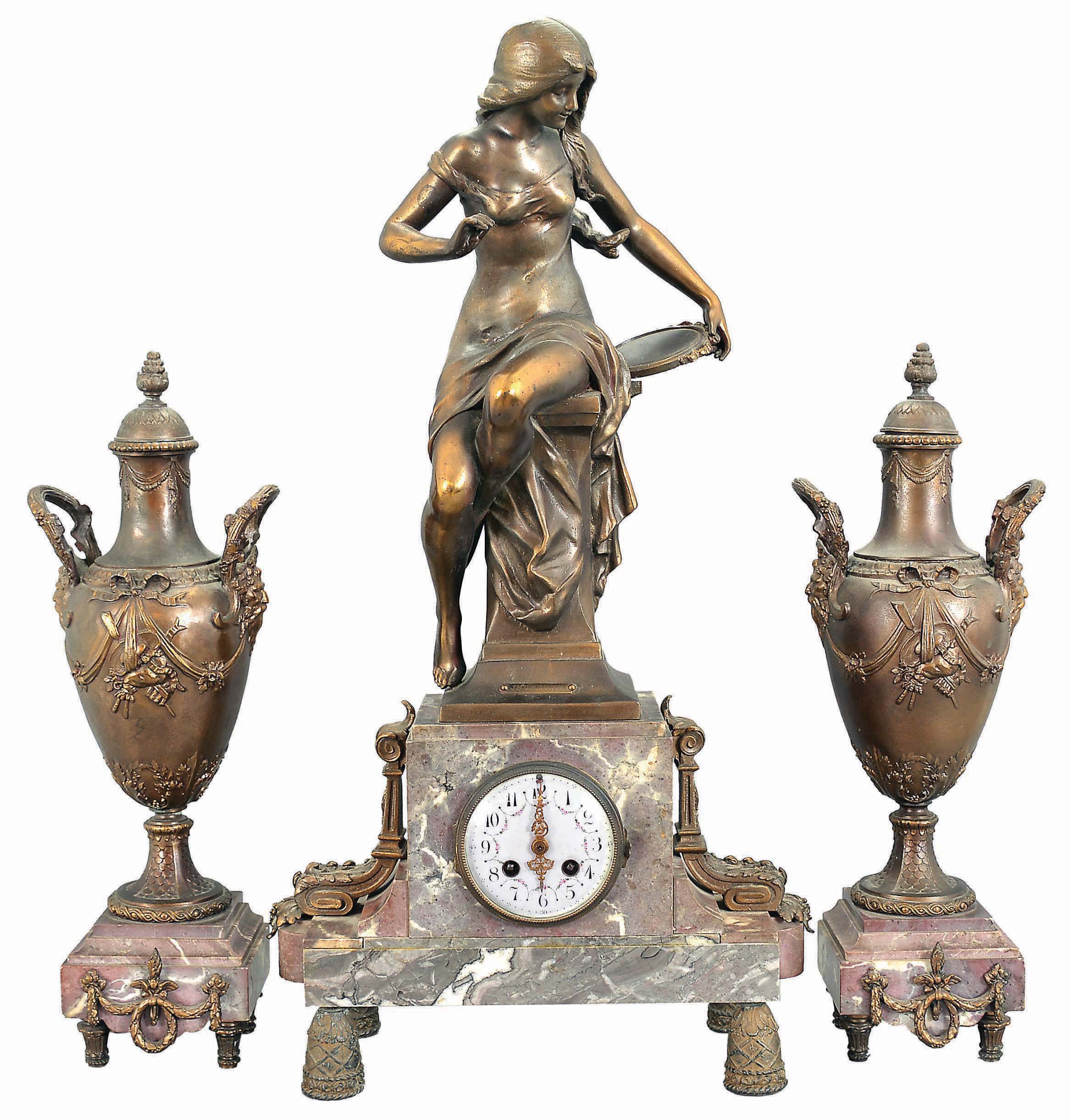 Irving Miller &amp; Co., France, three-piece figural mantel clock with garniture, red and grey marble base on cast bell-shaped feet supporting clock with polychrome enamel dial, flanked by acanthus ornaments and surmounted by a cast spelter female figure depicting youth titled "Jeunesse". The movement is an 8 day spring driven time and strike pendule de Paris. Matching marble and cast metal vases with lids. — Antique Clocks Price Guide
