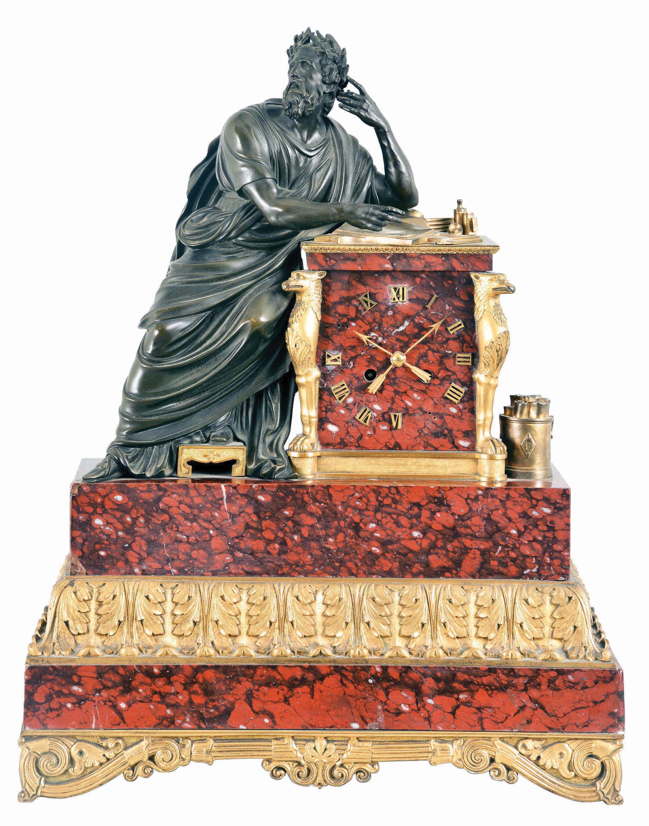 Cailly Freres, Paris, a bronze and griotte marble figural mantel clock, the stepped marble case with gilt, classical ornament, and surmounted by a patinated, seated male figure with robe and laurel crown, in a contemplative pose, the clock dial also of red marble and with applied, gilt Roman numerals and arrow form hands, signed, 8 day, time and strike pendule de Paris movement, originally with silk thread suspension — Antique Clocks Price Guide
