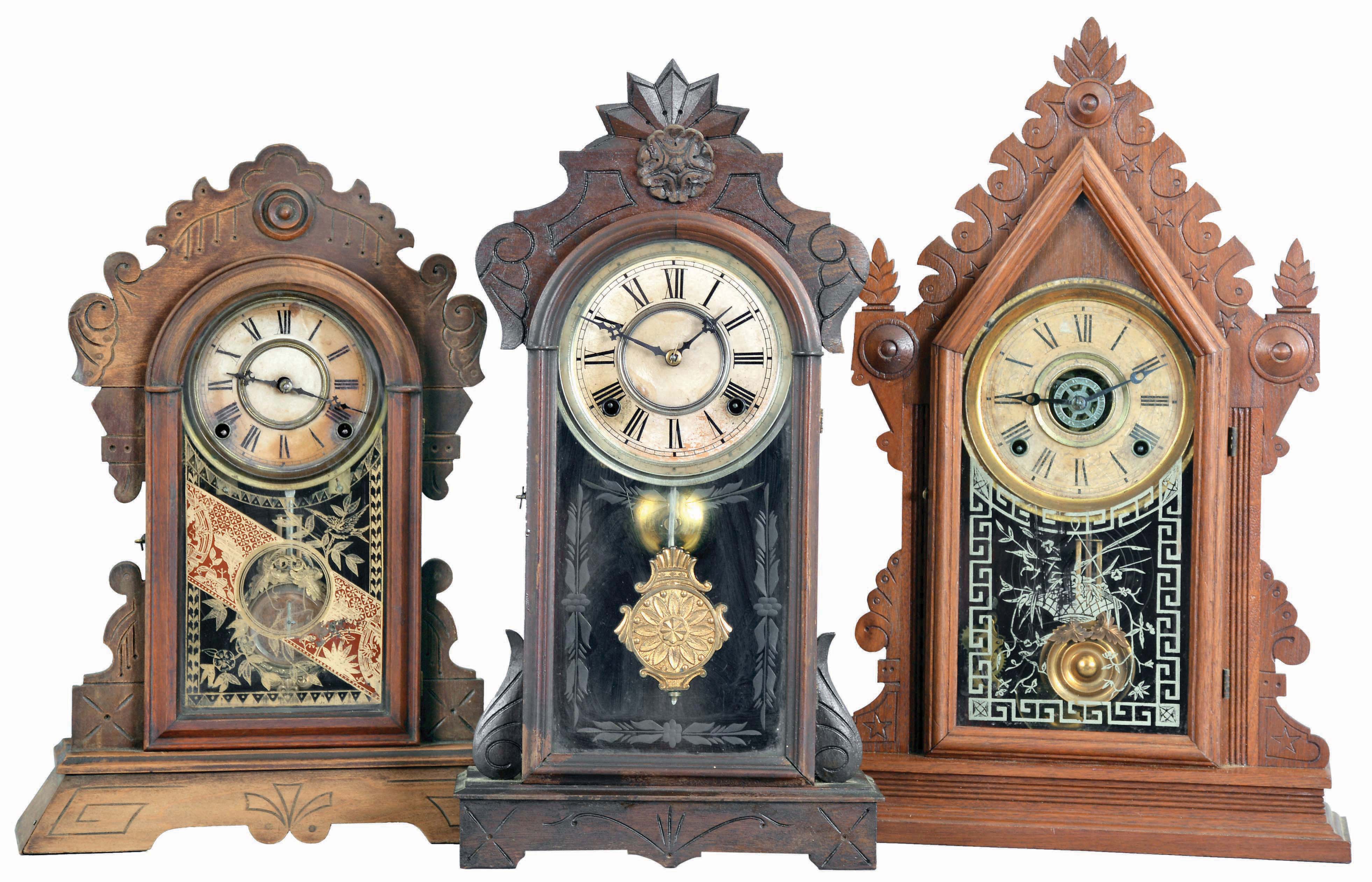 Clocks- 3 (Three): (1) E, Ingraham CLock Co., Bristol, Conn., "Cadet" shelf clock with a spring driven, 8 day time, strike &amp; alarm movement in a walnut case, c1881; (2) Gilbert Clock Co., Winsted, Conn., "Argus" shelf clock with a spring driven, 8 day, time and strike movement (George B. Owen, Winsted, Conn.) in a walnut case, c1885. (3) F. Kroeber Clock Co., 6 Cortlandt Street, New York, "Wasp" shelf clock with a spring driven, 8 day, time and strike movement in a walnut case, c1884. — Antique Clocks Price Guide