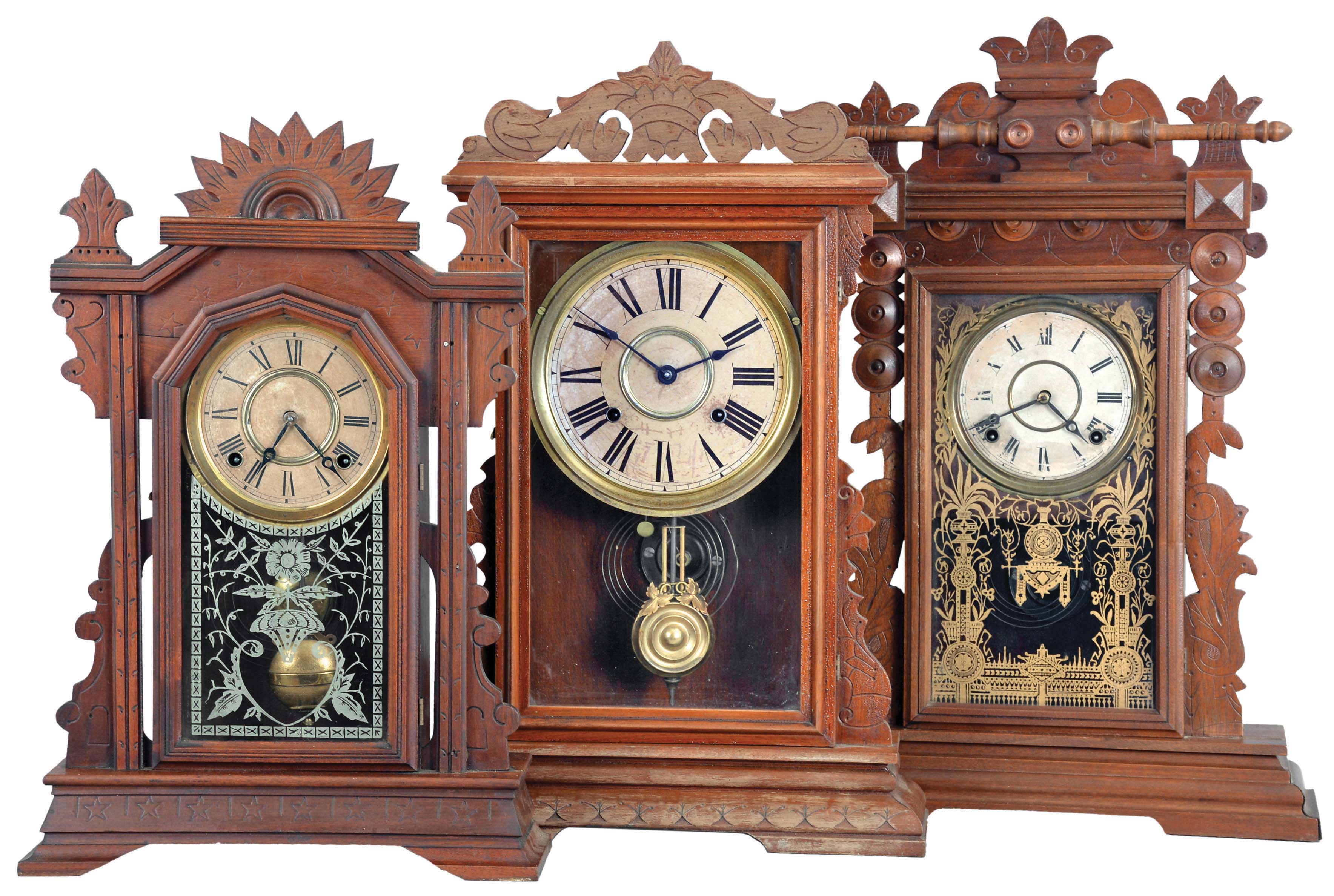 Clocks- 3 (Three): (1) E. Ingraham &amp; Co.,Bristol, Conn., "Cartoon" shelf clock with a spring driven, 8 day, time and strike movement in a walnut case, c1889; (2) E. Ingraham &amp; Co., Bristol, Conn., "Farren" premium model made for Farren Brothers shelf clock with a spring driven, 8 day, time and strike movement in a walnut case, c1880. (3) E. Ingraham &amp; Co., Bristol, Conn., "Ingot" shelf clock with a spring driven, 8 day, time and strike movement in a walnut case, c1896. — Antique Clocks Price Guide