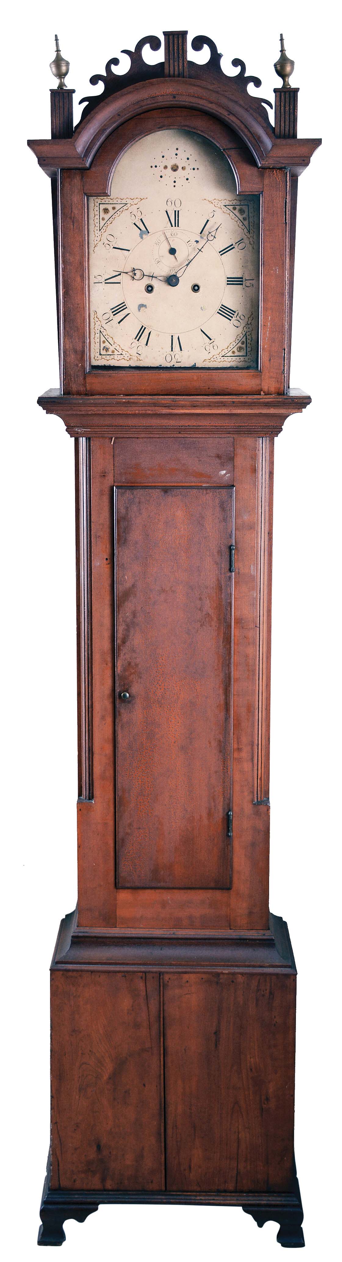 Maine, tall case clock, 8 day, time and bell strike, weight driven movement with unusual cast iron plates in a cherry case with fret work top, ogee feet and two brass finials and painted metal dial. — Antique Clocks Price Guide