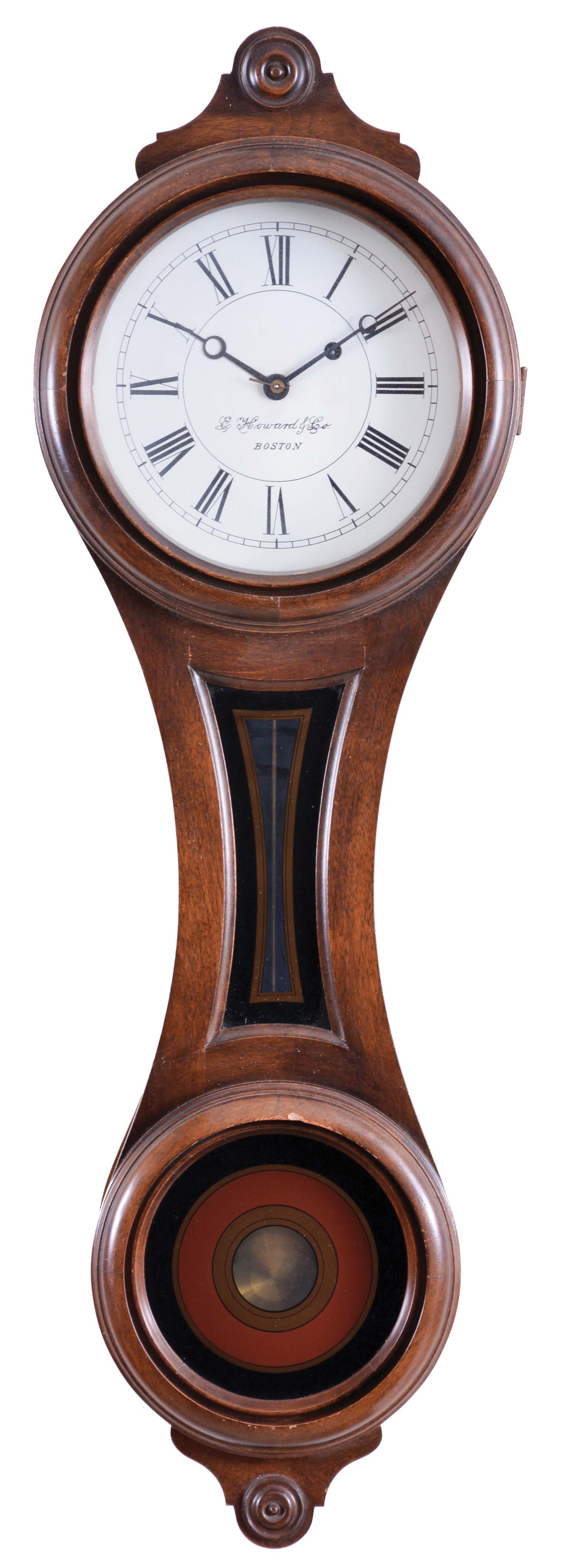E. Howard &amp; Co.. Boston, Mass., "Regulator No. 10" figure eight reissue wall clock, Serial #211, the walnut case in the figure eight form with roman numeral metal dial signed "E. Howard &amp; Co./Boston", the full length door with glazed opening for the dial, waist section with gold and black geometric shaped decoration and lower 6-inch opening with black, gold and maroon concentric circles and center for pendulum viewing, lower turned drop at the base, eight day brass time only movement with front plate stamped "E. Howard &amp; Co./Boston", "No. 10", "SN 211" and "6/76", recoil escapement all powered by an iron weight and regulated by a brass rod, and brass-faced pendulum bob. — Antique Clocks Price Guide