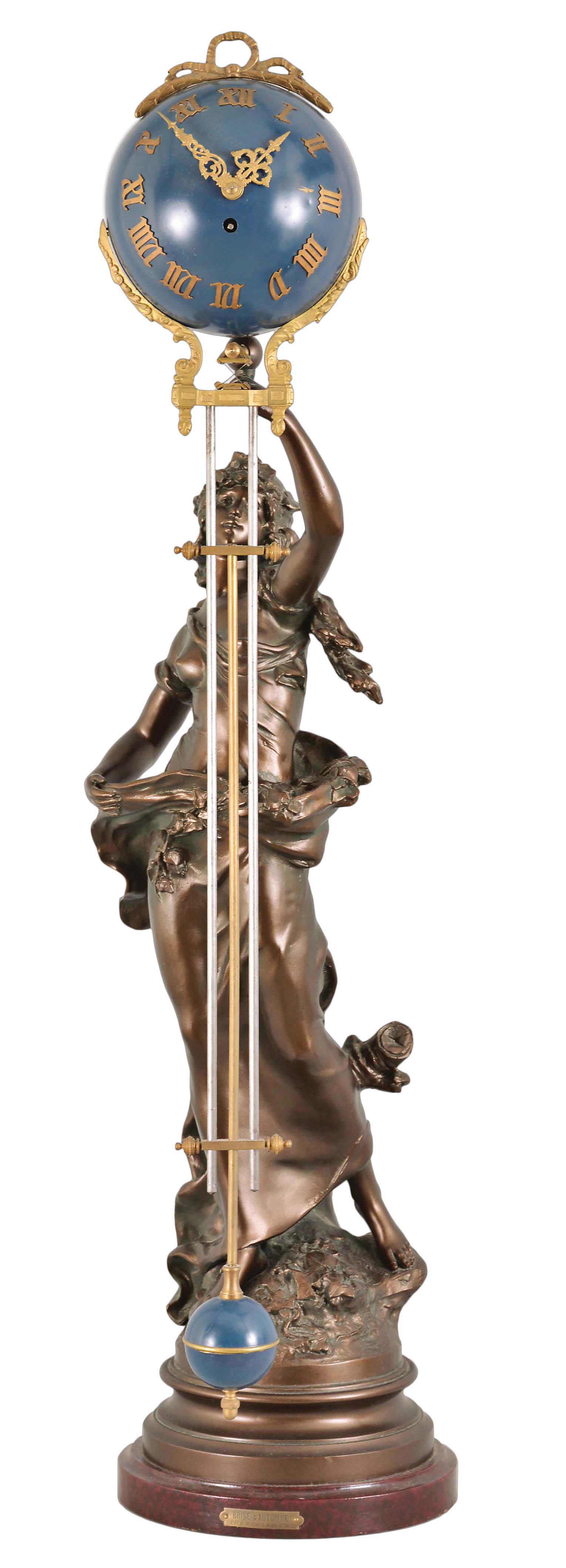 France, a large figural swinging clock, the female figure after "Brise d'Automne" by Auguste Moreau, her hair and dress blown in the autumn breeze, and holding the clock aloft in her left hand, the 8 day timepiece movement contained in the blue, upper sphere, and mounted with gilt, stylized Roman numerals and Louis XV style hands, with three rod gridiron style connection to the smaller, lower ball — Antique Clocks Price Guide