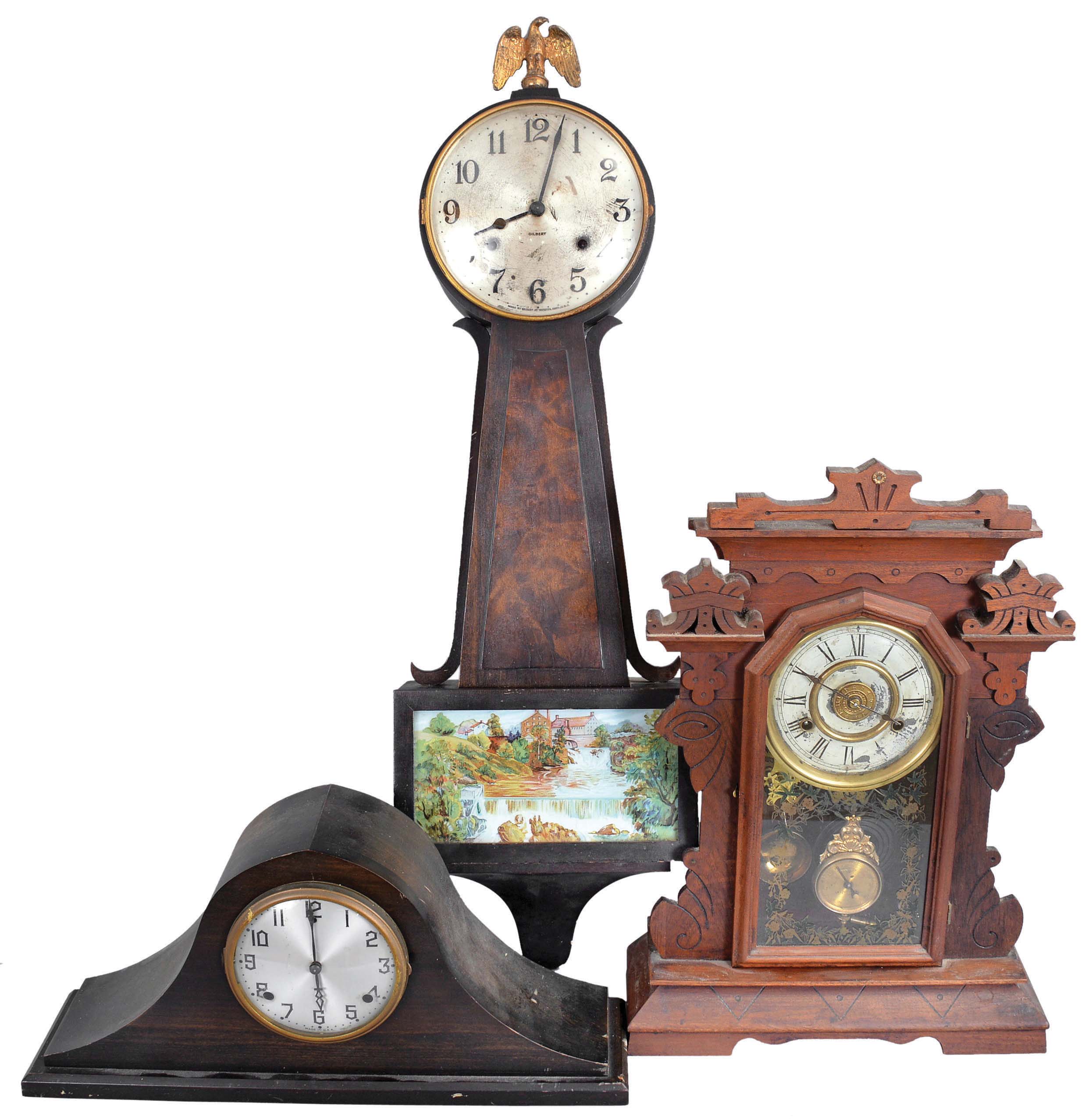Clocks- 3 (Three) wood cased clocks: (1) New Haven Clock Co., New Haven, Conn., "No. 540", 8 day spring driven, time &amp; strike with alarm parlor clock in a walnut case, c. 1890; (2) Wm. L. Gilbert Clock Co., Winsted, Conn., "Yorktown", 8 day spring driven, time &amp; strike banjo clock with mahogany finish and burl veneer panel, c. 1930; (3) Wm. L. Gilbert Clock Co., Winsted, Conn., tambour clock, 8 day spring driven, time &amp; bim-bam strike tambour clock in a walnut case, c. 1930. — Antique Clocks Price Guide