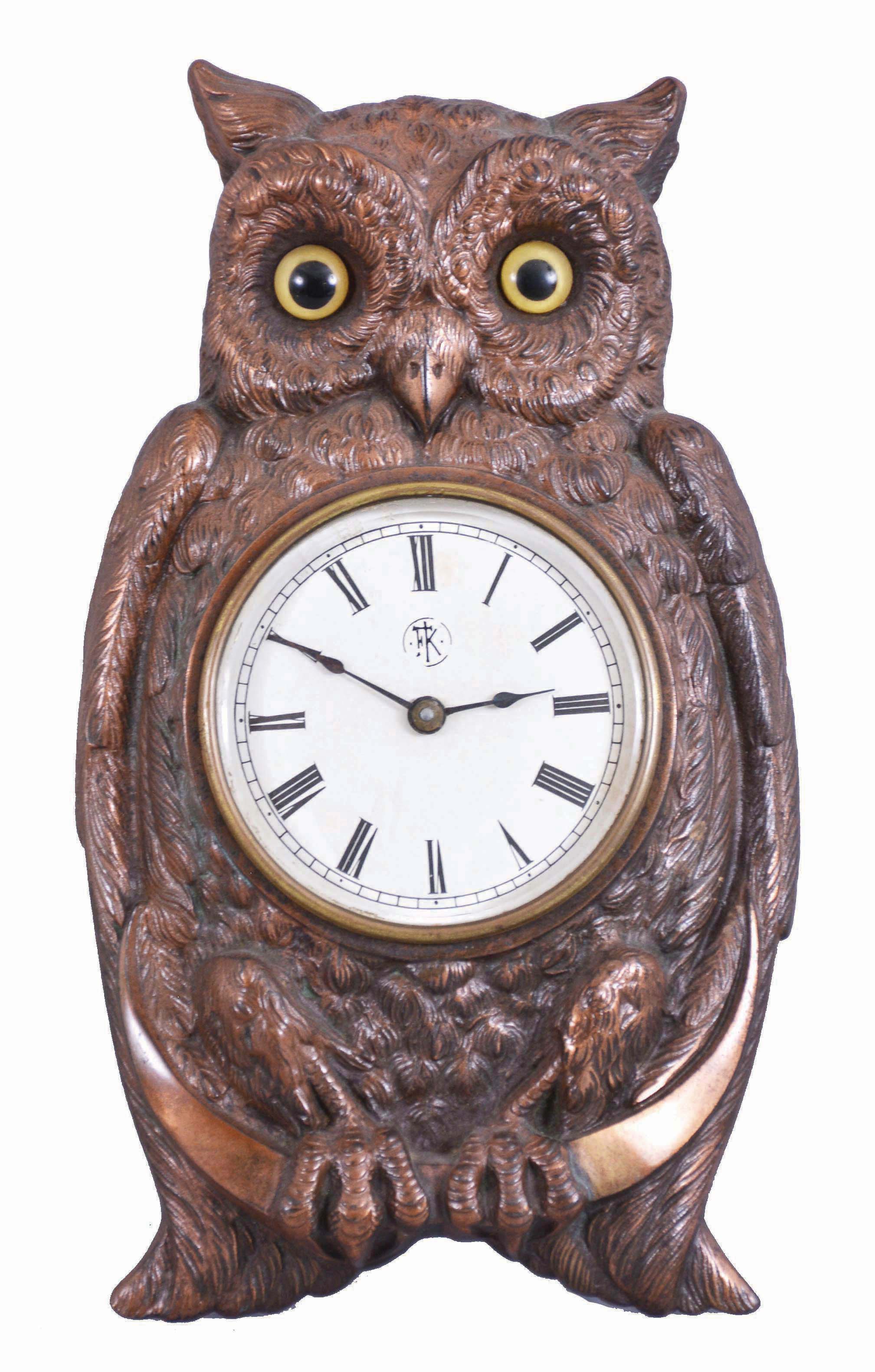 F. Kroeber Clock Co., New York, "Brass Owl", 30 hour, time and alarm, spring driven brass movement in a brass casting of an owl with glass eyes. — Antique Clocks Price Guide