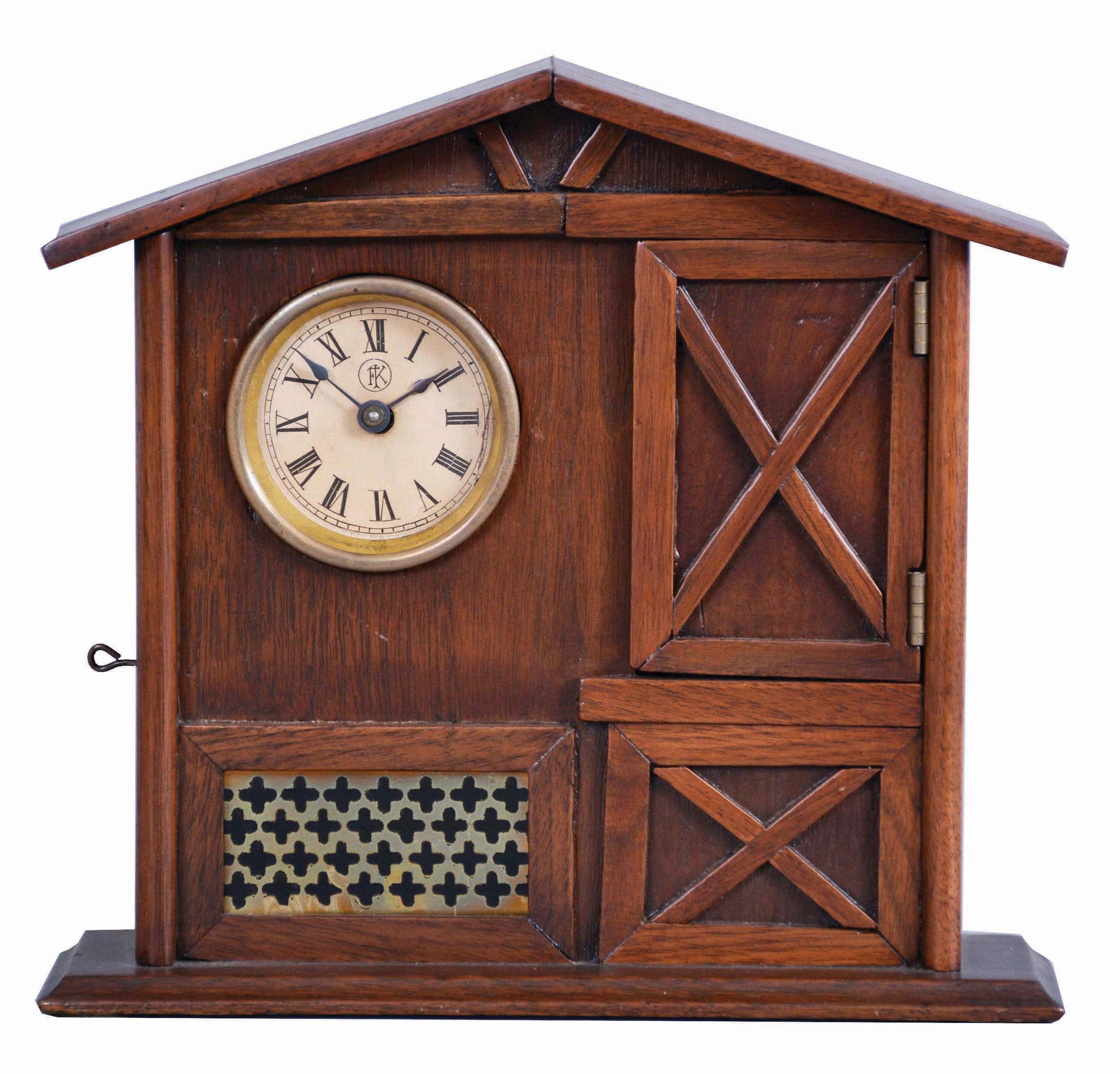 F. Kroeber Clock Co., New York, "Mountain Boy", 30 hour, time and alarm, spring driven brass movement in a walnut case resembling a cottage or barn with bisque figure of a boy urging the owner to rise. — Antique Clocks Price Guide