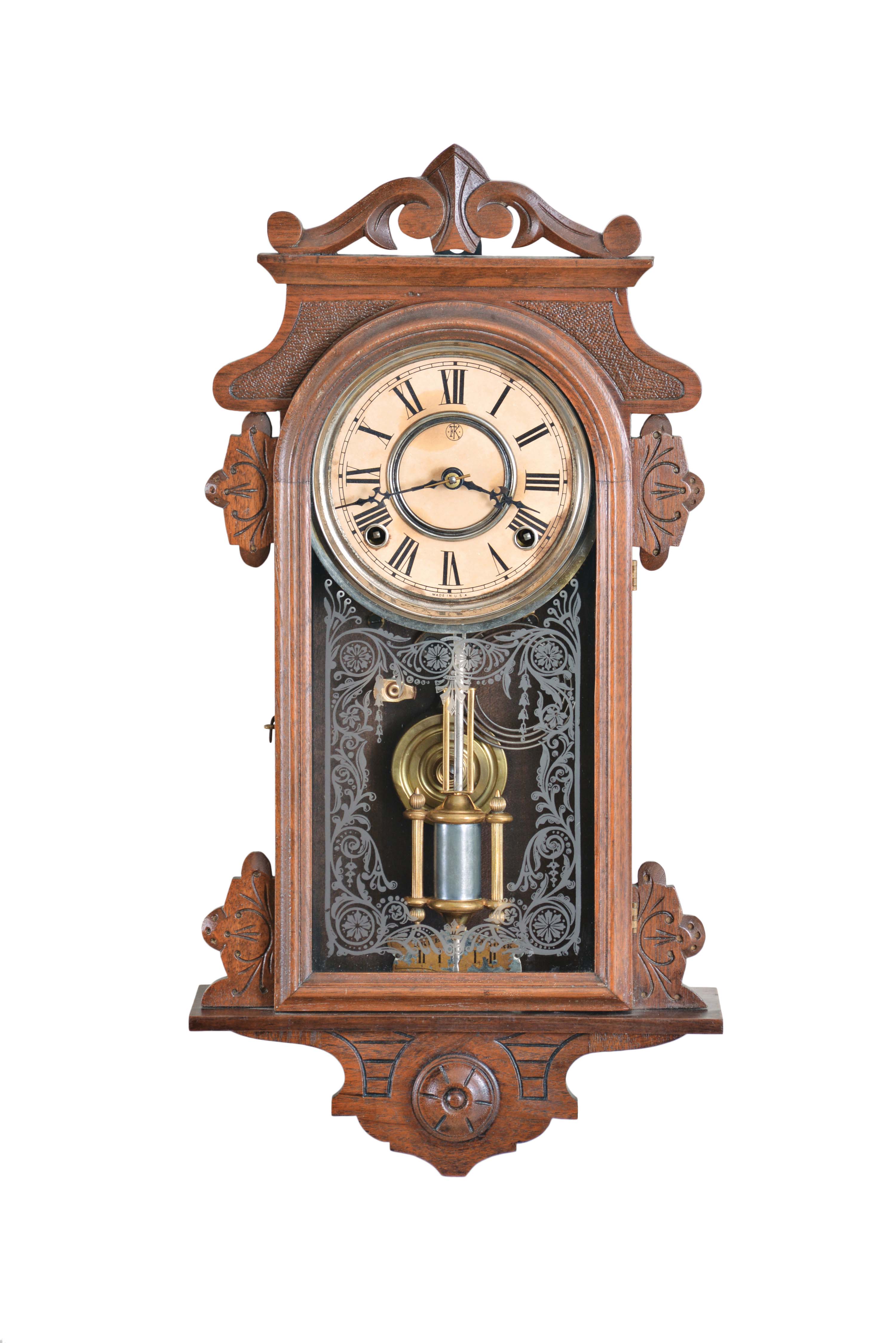 F. Kroeber Clock Co., New York, "Eight Day Rambler" wall hanging clock, 8 day, time and strike, spring driven movement in a walnut case with cathedral gong, 5 inch paper dial, and single barrel pendulum. — Antique Clocks Price Guide