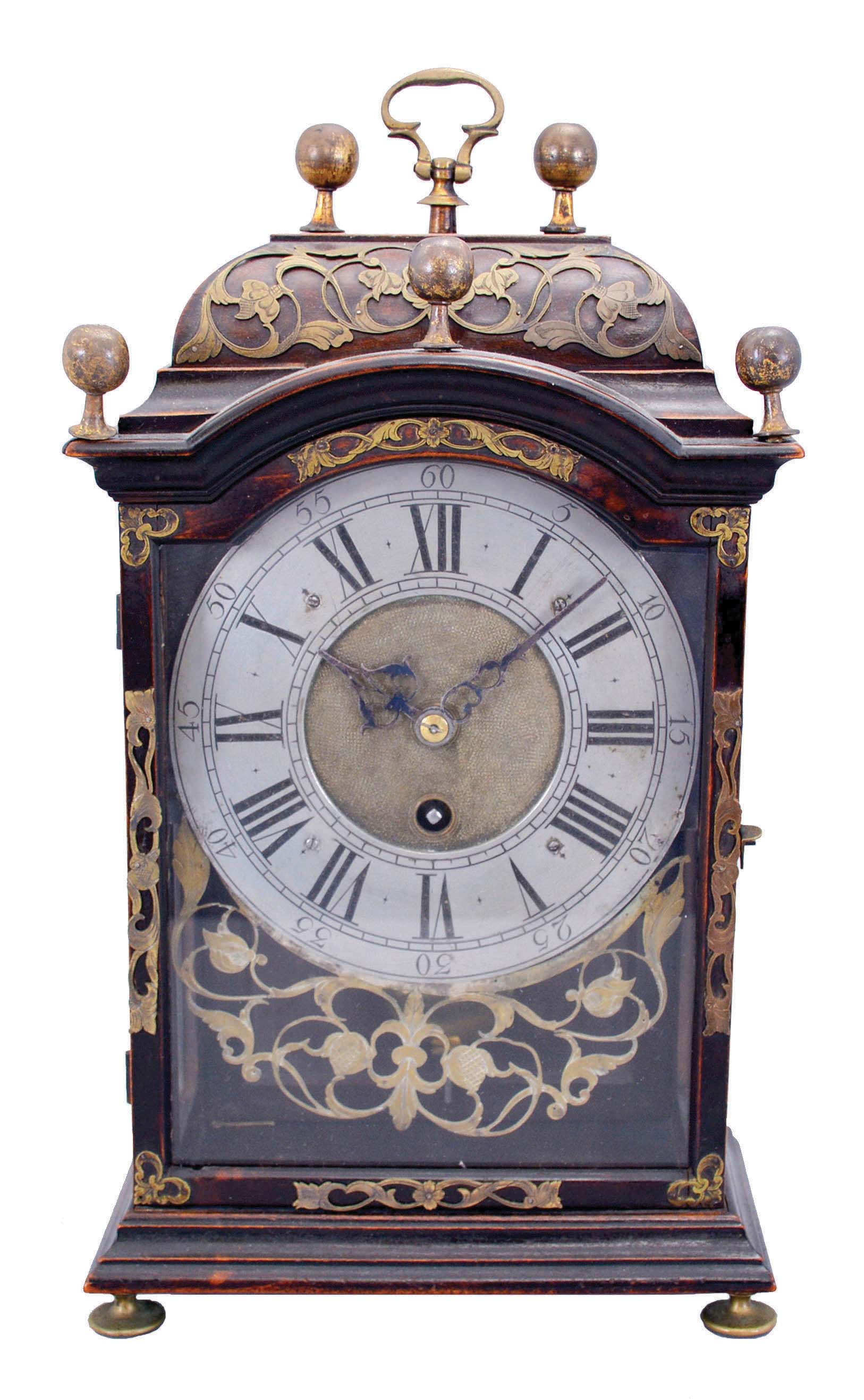 J. P. Huguenin, La Chaux de Fonds, "pendule Neuchateloise" small bracket timepiece in an ebonized wood case with fretted and engraved brass overlay, duration of crown wheel movement approx. 2 and half days. — Antique Clocks Price Guide