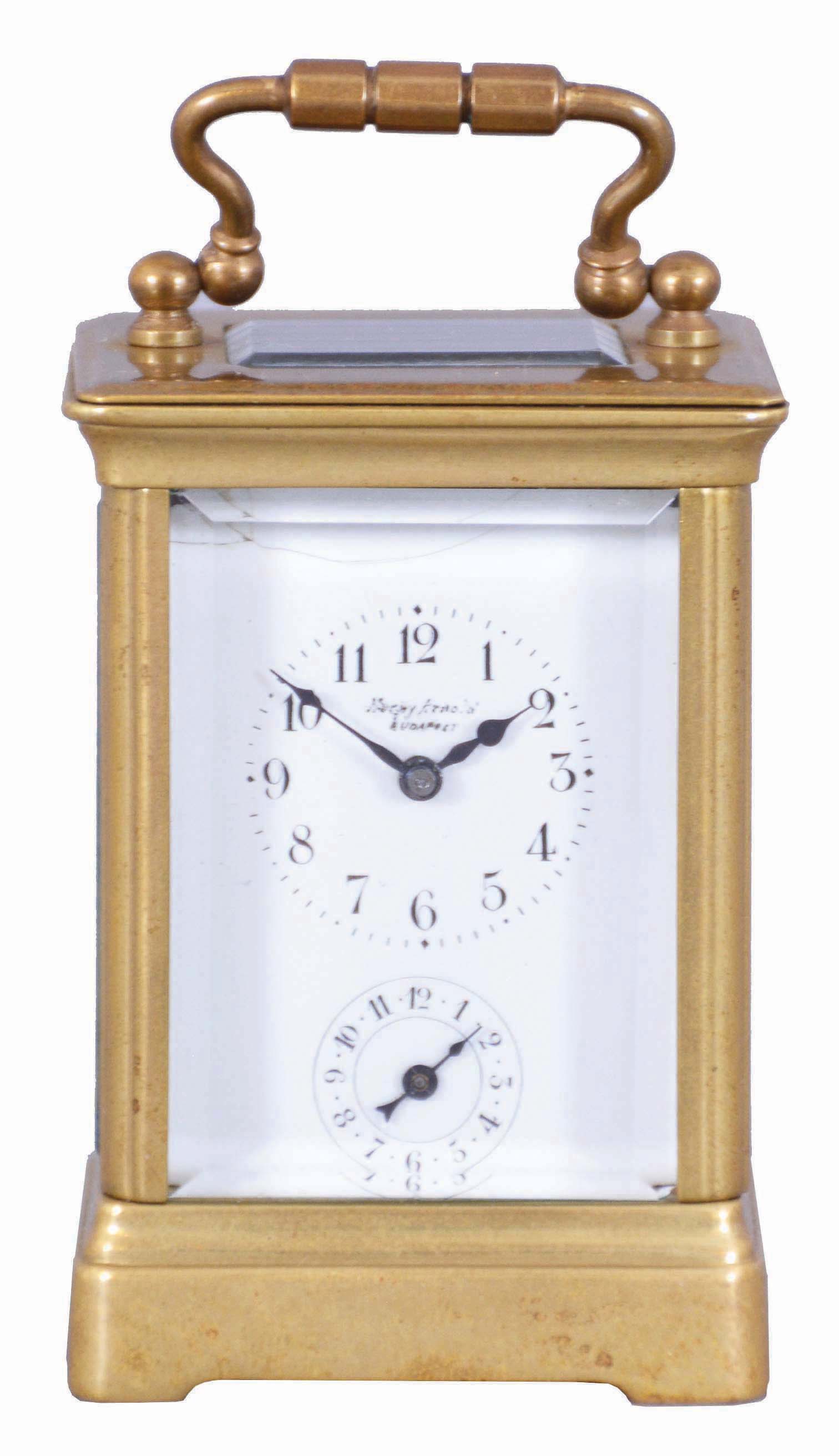 France, for H. Arnold, Budapest, a miniature carriage timepiece with alarm, mignonette #1 size Obis case with beveled glasses, Arabic numeral white enamel dial, blued steel hands, 8 day brass movement with lever platform, the alarm sounding on a coiled gong concealed in the base — Antique Clocks Price Guide