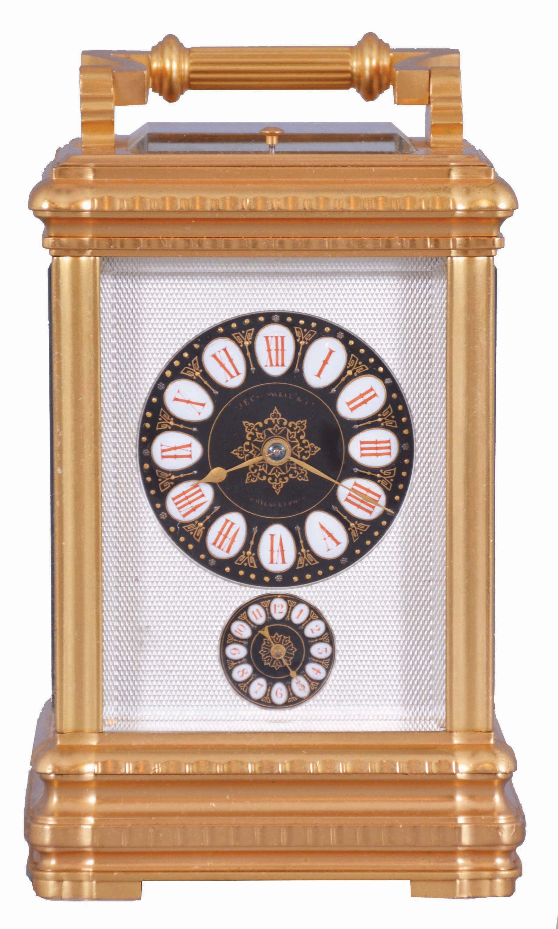 Margaine, Paris, for J.E. Caldwell, Philadelphia, a large and decorative striking carriage clock, the gilt Gorge variant case set with beveled glasses, engine turned silvered dial mask surrounding the time and alarm displays, each with gilt decorated black ground, and with convex, white, egg shaped reserves for the red Roman and Arabic numerals, gold spade and poker hands, 8 day time, strike and alarm movement with lever platform, repeating the last hour on demand, the back plate with Margaine's mark, serial #5295 — Antique Clocks Price Guide