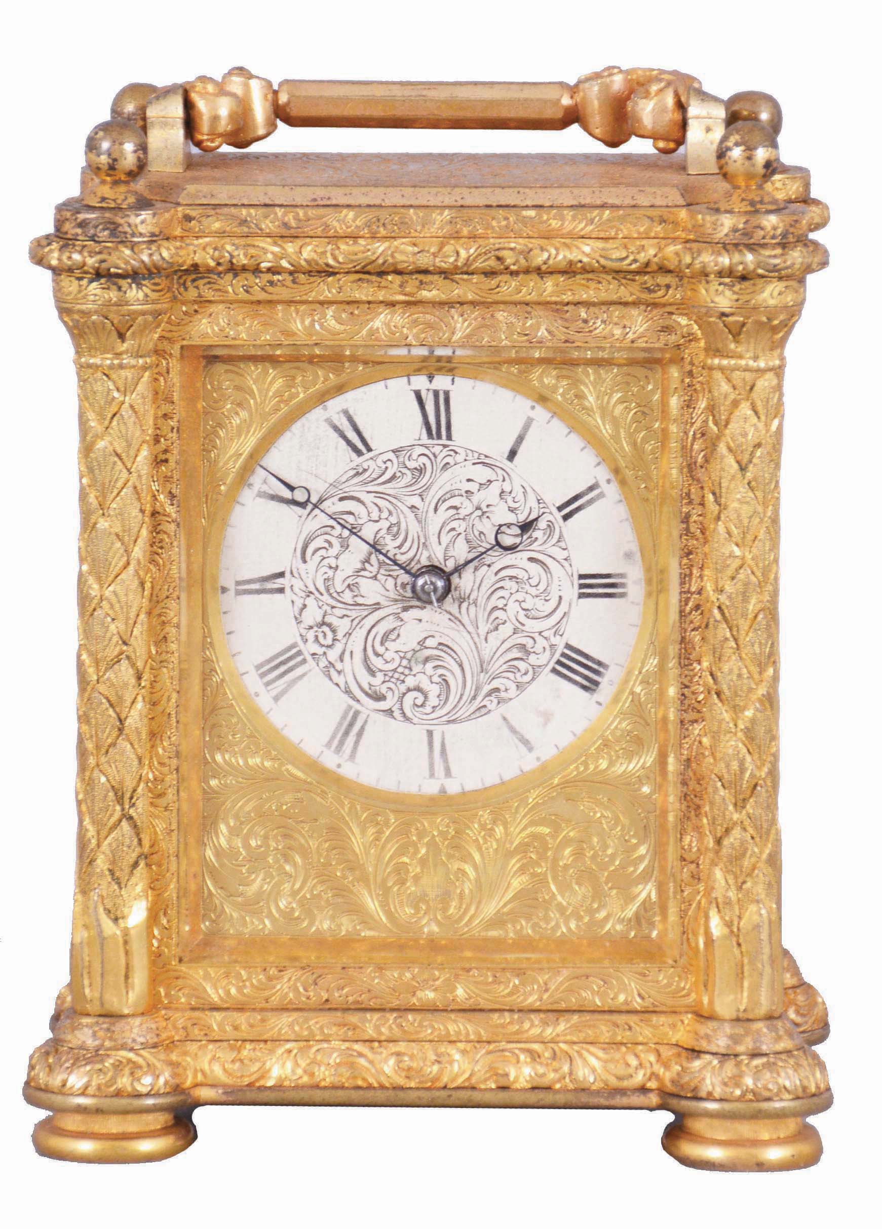 Aubert and Klaftenberger, London, a fine, small, week going English carriage timepiece, the gilt case with foliate engraving, the corners with chased, leaf decorated columns, and signed "L. Lange", Roman numeral silvered dial, the center also with engraving matching the case, blued steel Breguet style hands, and 8 day, 6 pillar fusee movement with lever escapement, serial #1061. — Antique Clocks Price Guide