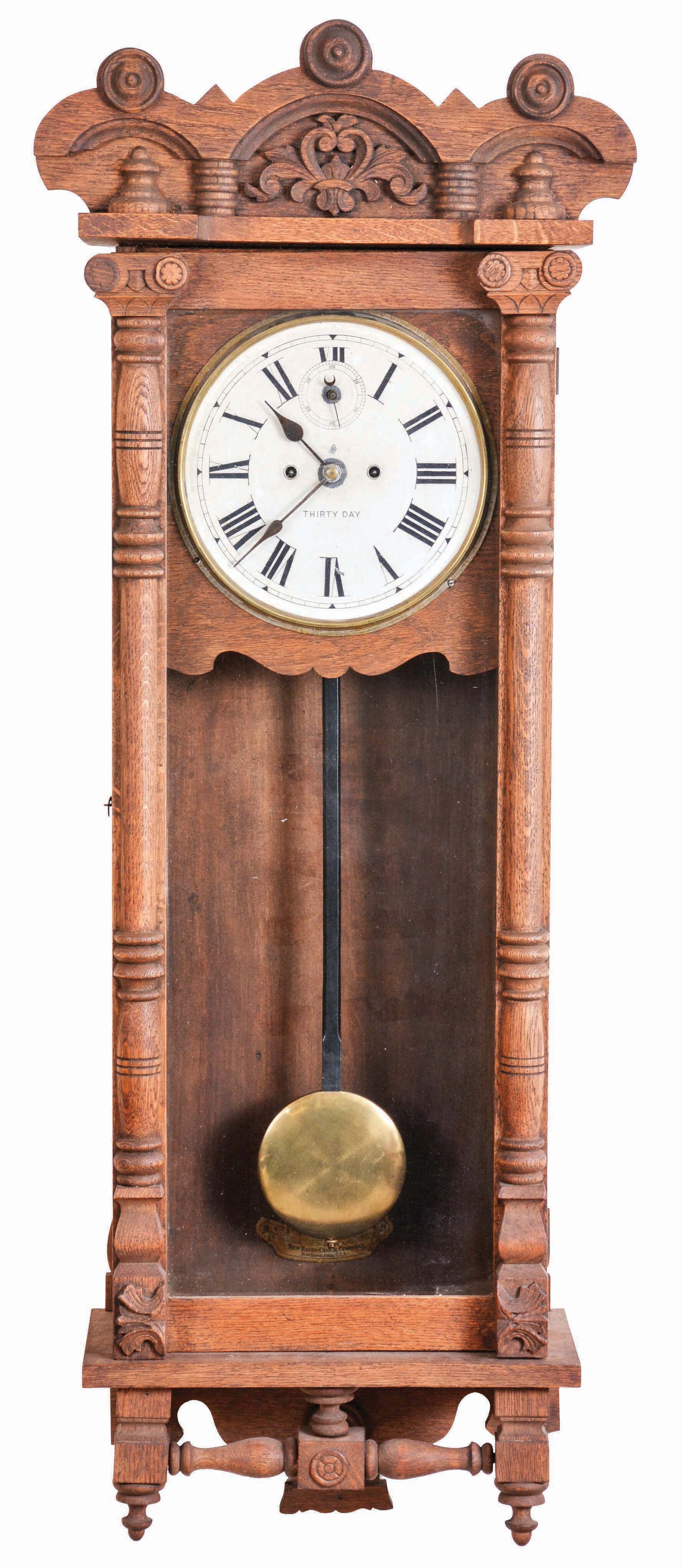 New Haven Clock Co., New Haven, Conn., "Elfrida" hanging clock with a spring driven 30 day timepiece movement in an oak case. — Antique Clocks Price Guide