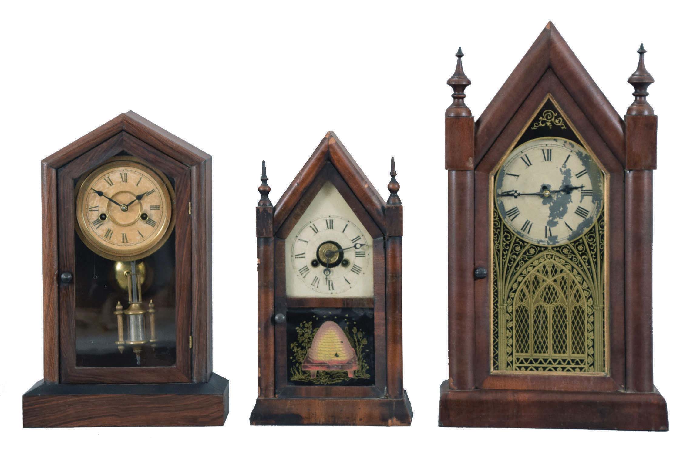 Clocks- 5 (Five): (1) New Haven Clock Co., New Haven, Conn., "Sharp Gothic" shelf clock with a spring driven, 8 day, time and strike movement in a mahogany veneered case, c1880; (2) Jerome &amp; Co., New Haven, Conn., miniature steeple shelf clock with a spring driven 30 hour time and alarm movement in a mahogany veneered case, c1870. (3) F. Kroeber Clock Co., New York, "Dictator" shelf clock with a spring driven 30 hour time and strike movement in a rosewood veneered case, c1885. (4) Brewster &amp; Ingrahams, Bristol, Conn., Round Gothic shelf clock with a spring driven, 8 day, time and strike movement in a mahogany veneered case, c1850, (5) Waterbury Clock Co., Waterbury, Conn., Round Gothic shelf clock with a spring driven 30 hour time, strike and alarm movement in a mahogany veneered case, c1865. — Antique Clocks Price Guide