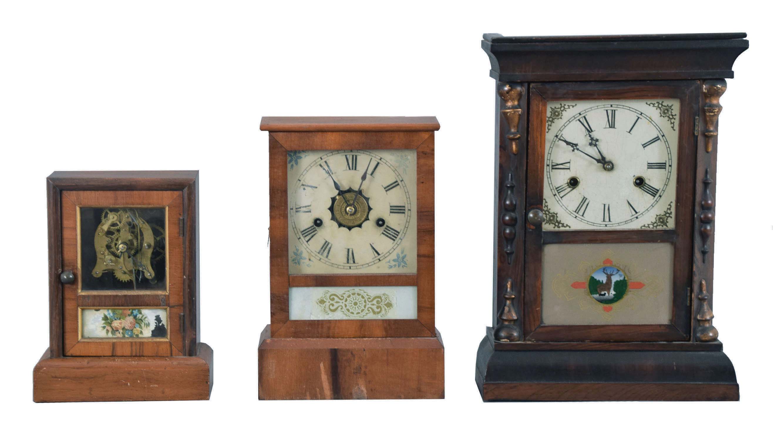 Clocks- 6 (Six): (1) Seth Thomas Clock Co., Thomaston, Conn., "Cottage Extra" shelf clock with a spring driven, 8 day, time and strike movement in a rosewood veneered case; (2) E. N. Welch, Forestville, Conn., cottage shelf clock with a 30 hour timepiece movement in a rosewood veneered case. (3) Waterbury Clock Co., Waterbury, Conn., cottage shelf clock with a spring driven 30 hour time and strike movement in a rosewood veneered case. (4) Seth Thomas Clock Co., Thomaston, Conn., cottage shelf clock with a spring driven 30 hour time and alarm movement in a rosewood veneered case. (5) Jerome &amp; Co., New Haven, Conn., "Cottage No. 2" shelf clock with a spring driven 30 hour time, strike and alarm movement in a veneered case. (6): Gilbert Clock Co., Winsted, Conn., cottage shelf clock with a spring driven 30 hour time and strike movement in a rosewood veneered case. — Antique Clocks Price Guide