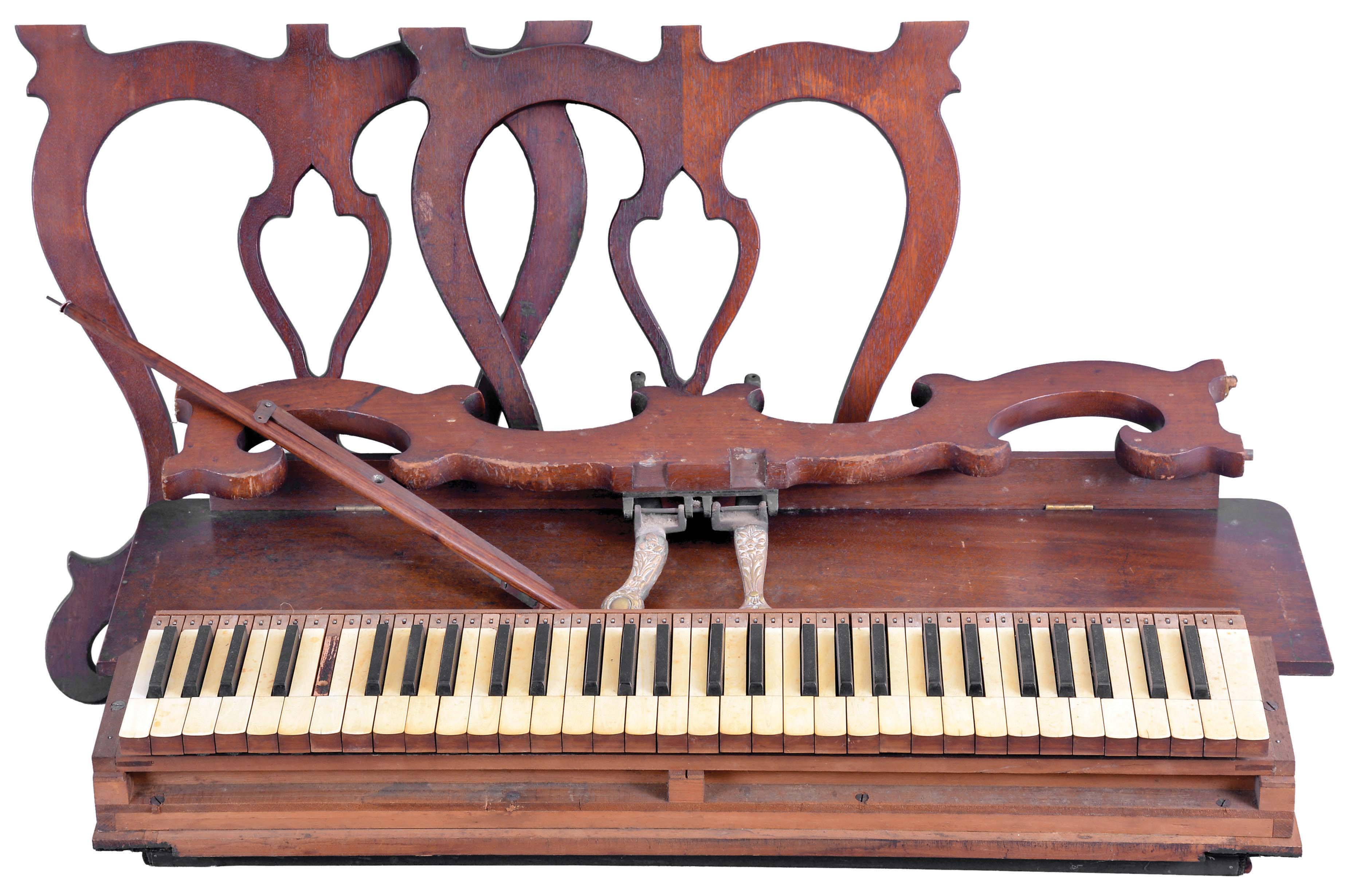 A. G. Marston, Campello, Massachusetts, 5 octave lyre-leg melodeon in a rosewood case. Also included is a second reed organ keyboard of roughly the same size and manufacture with a set of walnut legs. — Antique Clocks Price Guide